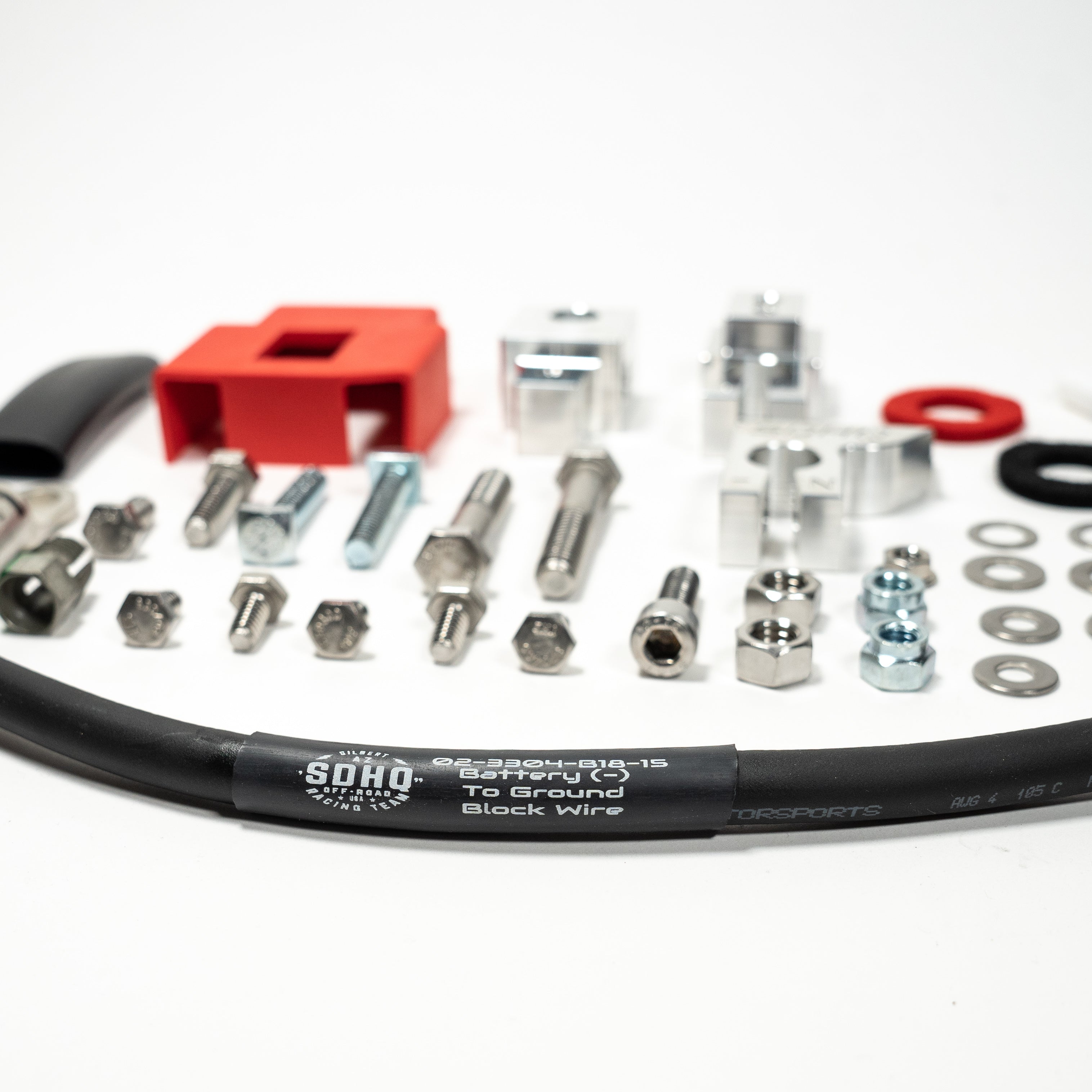 '21-23 Ford F-150 SDHQ Built Billet Battery Terminal Kit Close-up Display of Included Parts and Hardware