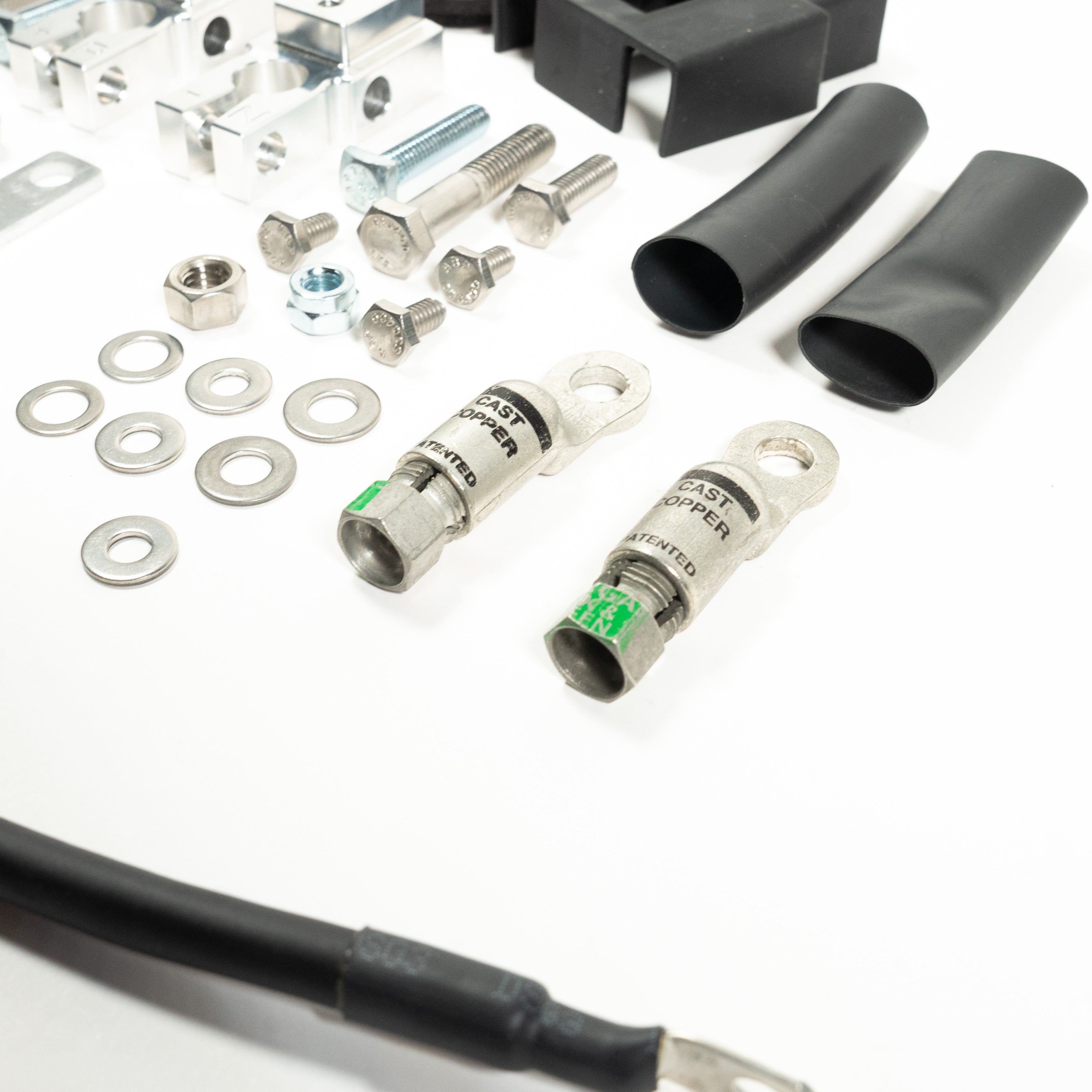 '20-22 Ford F250/350 SDHQ Built Billet Single Battery Terminal Kit Close-up Display of Included Parts and Hardware
