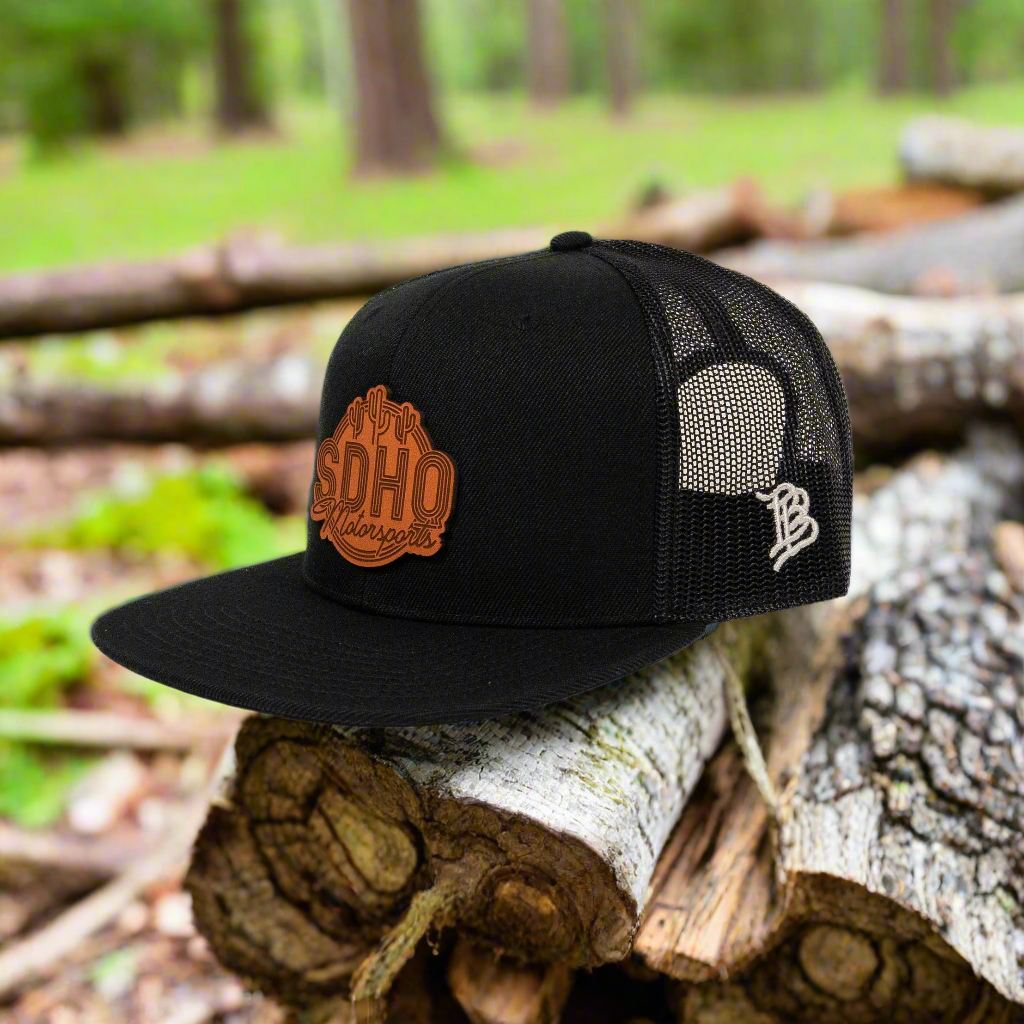 Flat Bill Trucker Hat w/ Leather SDHQ Motorsports Patch Side View Display