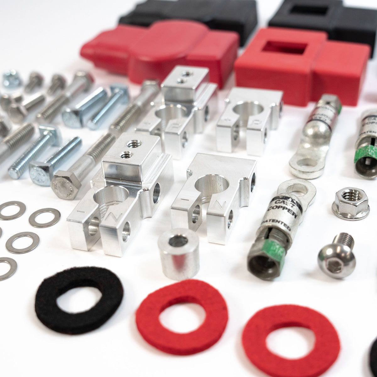 '17-Current Ford Super Duty (F250/F350/F450) SDHQ Built Billet Battery Terminal Kit Close-up Display of Included Parts