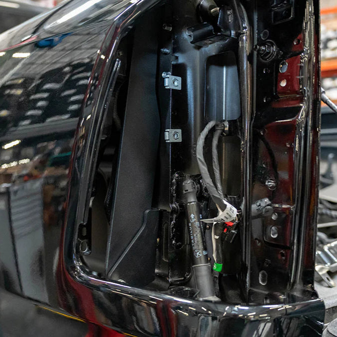 2025 Ram 1500 RHO SDHQ Built Hidden Bedside Support System display of parts installed with tail light removed during installation process