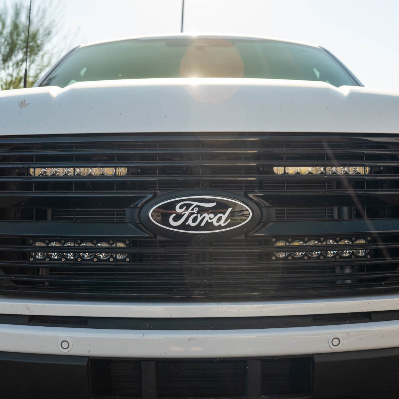 SDHQ Built '21-24 F150 / Raptor Behind the Grille Light Mounting Kit Close-up installed 