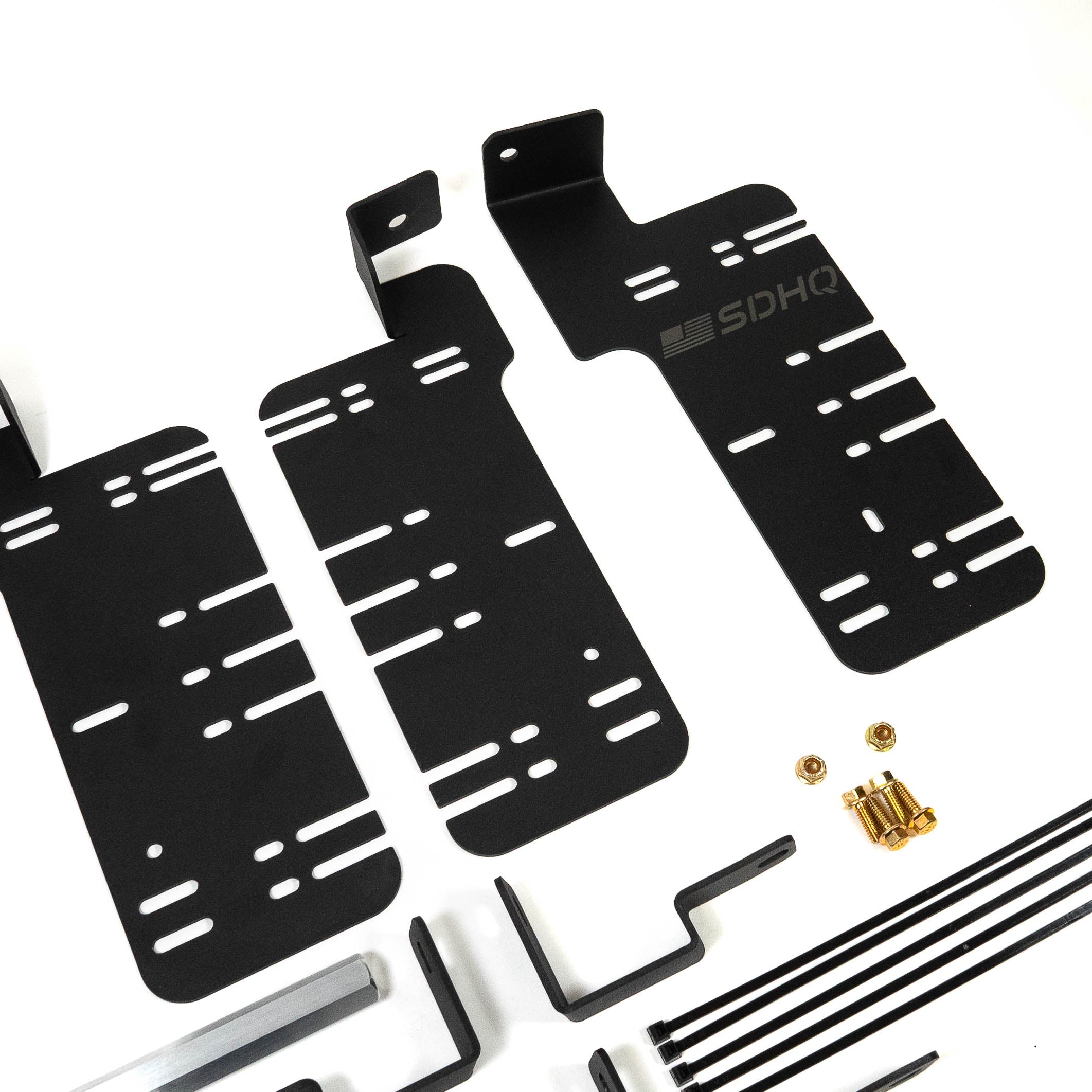 SDHQ Built '21-24 F150 / Raptor Behind the Grille Light Mounting Kit Display of included parts and hardware 