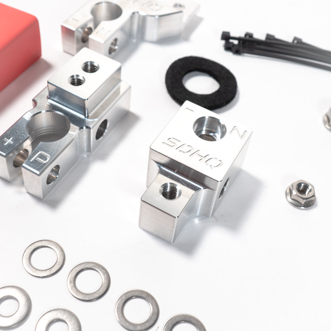 2018-2023 Jeep JL/JT (3.6L & 2.0L) SDHQ Built Billet Battery Terminal Kit Close-up display of included parts and Hardware 