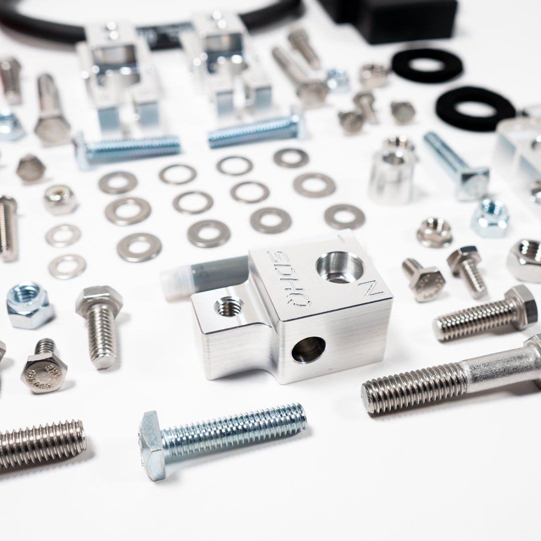 '19-23 RAM 2500/3500 Complete Billet Battery Terminal and Distribution Kit Close-up Display of Included Parts and Hardware 