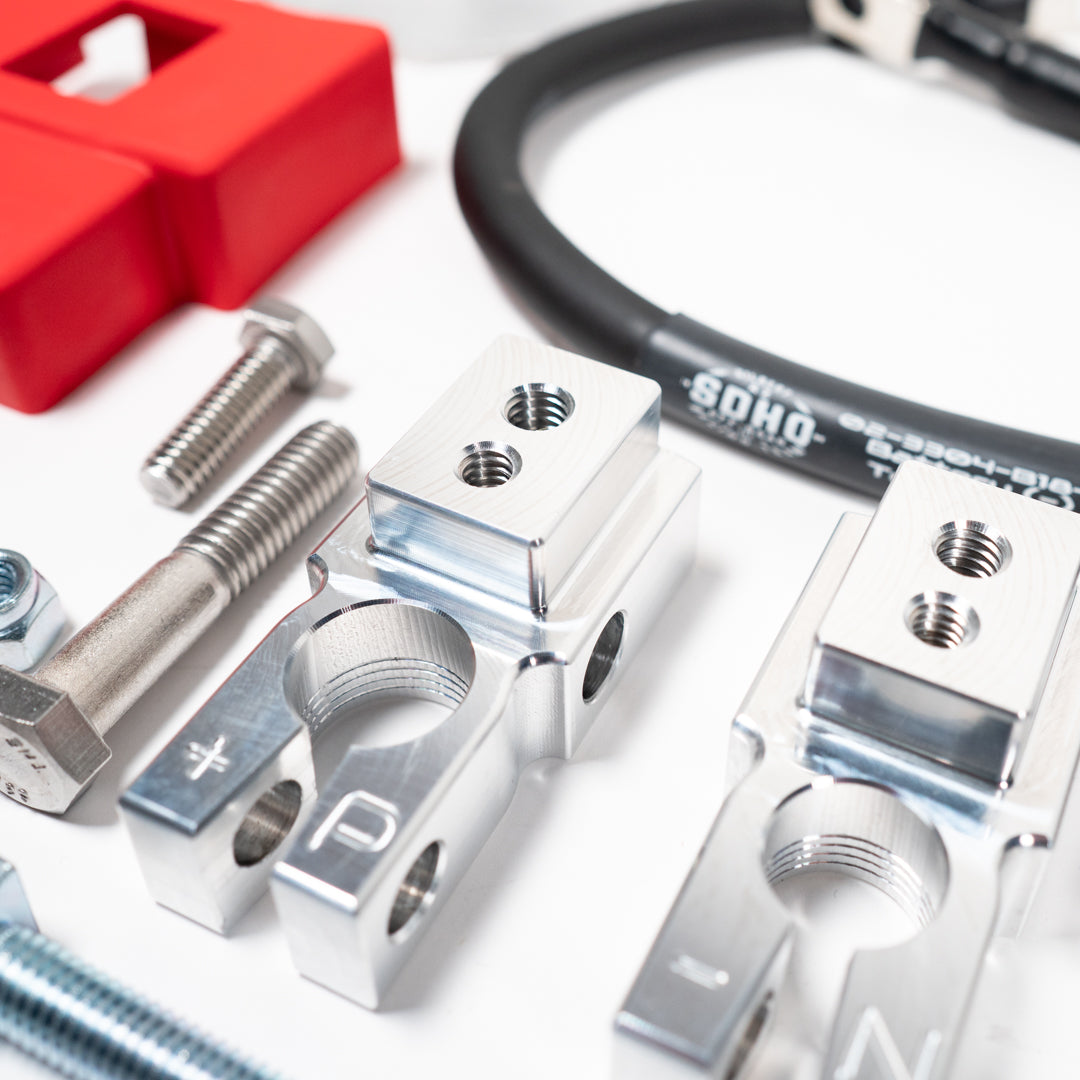 '19-23 RAM 2500/3500 Complete Billet Battery Terminal and Distribution Kit Close-up Display of Included Parts and Hardware 