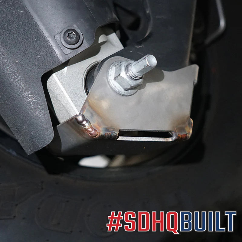 2025 Ram 1500 RHO SDHQ Built Rear Shock Guards installed up close with OEM Bilstein shocks