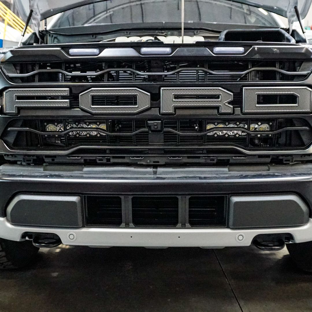 SDHQ Built '21-23 Raptor Behind the Grille Light Mounting Kit Close-up installed 