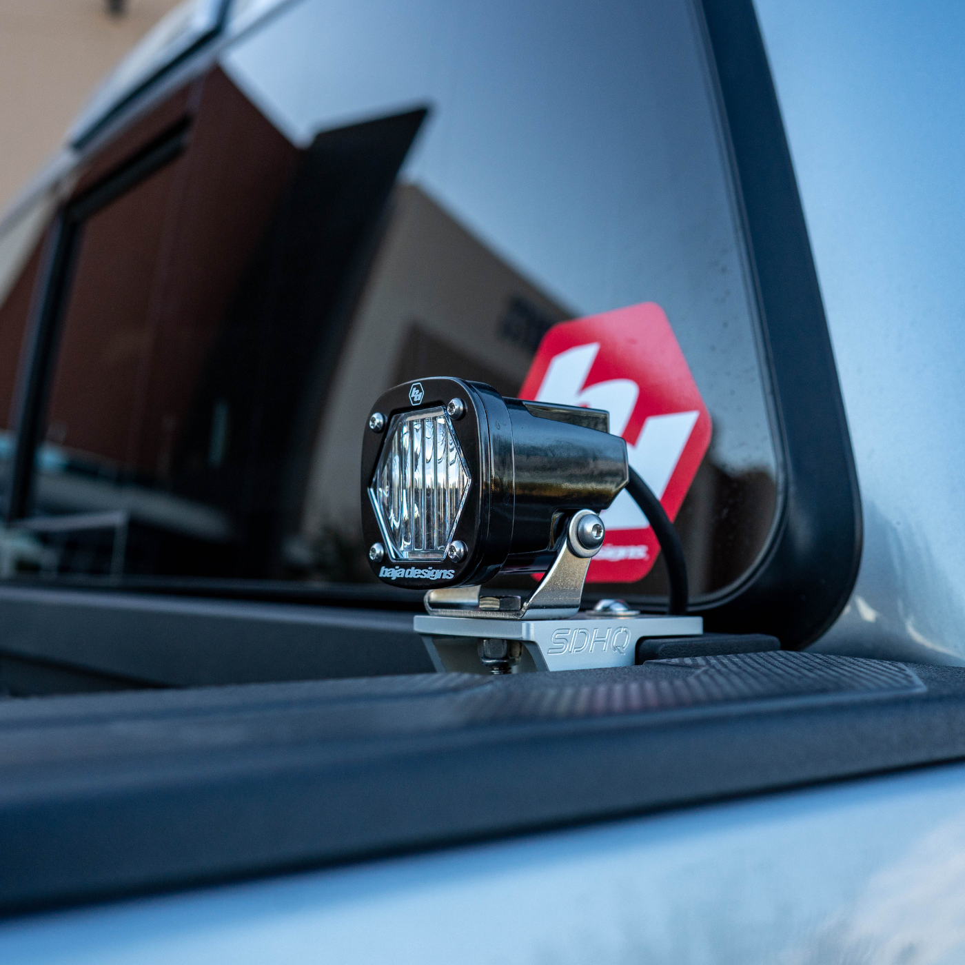 DISPLAY OF SDHQ BUILT BILLET CHASE LIGHT MOUNT WITH BAJA DESIGNS S1 MOUNTED TO CHASE LIGHT MOUNT