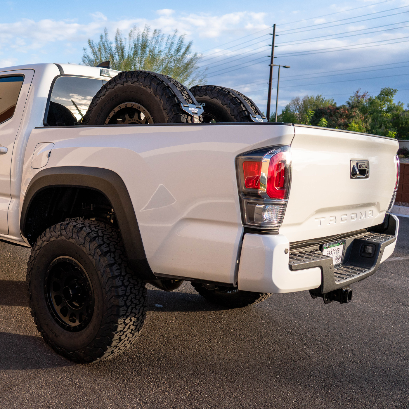 SDHQ BUILT CHASE RACK FOR 2ND AND RD GEN TACOMA DISPLAY INSTALLED IN BED OF TACOMA FROM OUTSIDE OF THE TRUCK TO SHOW VIEW FROM THE BACK SIDE OF THE VEHICLE