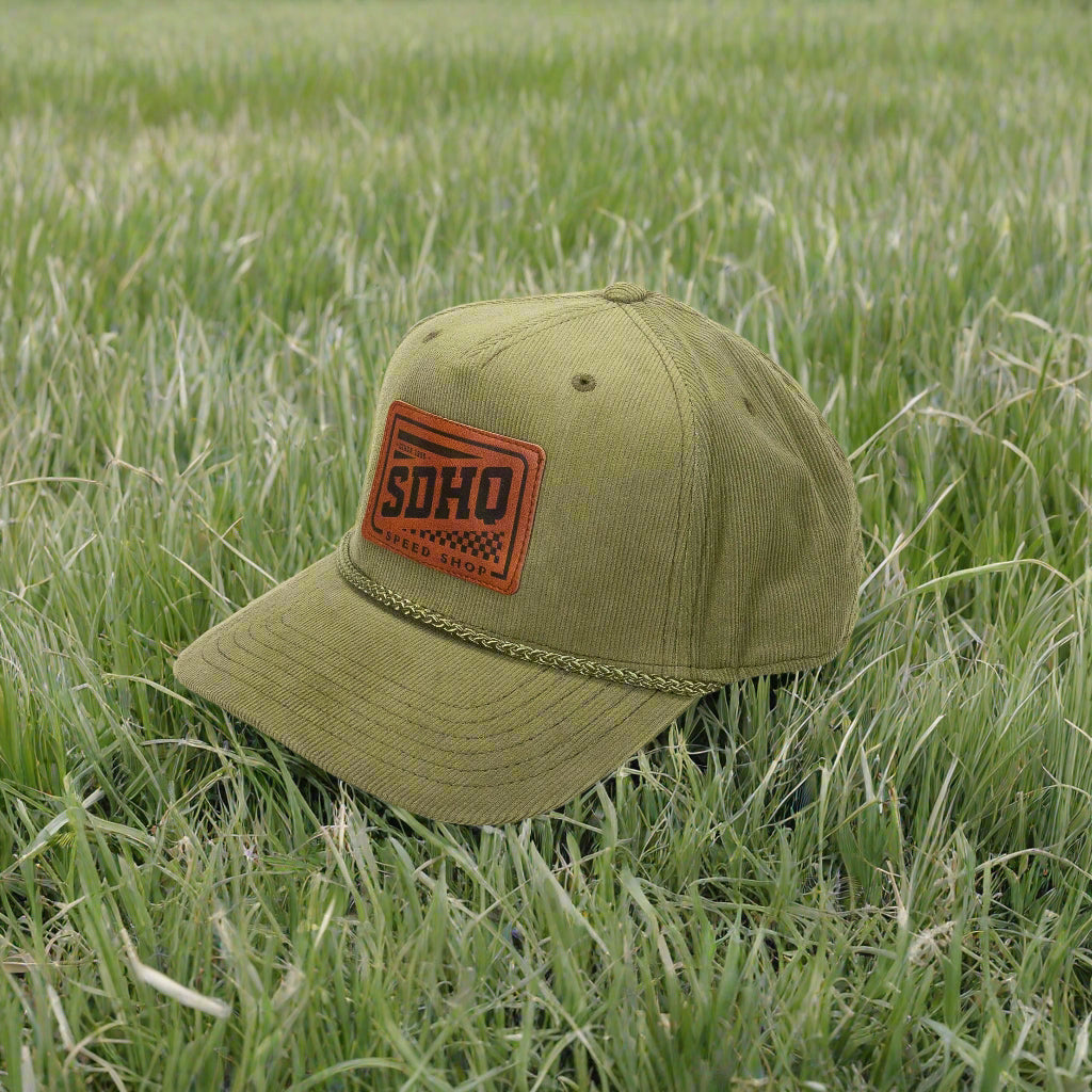 SDHQ Speed Shop Green Corduroy Hat display in grass