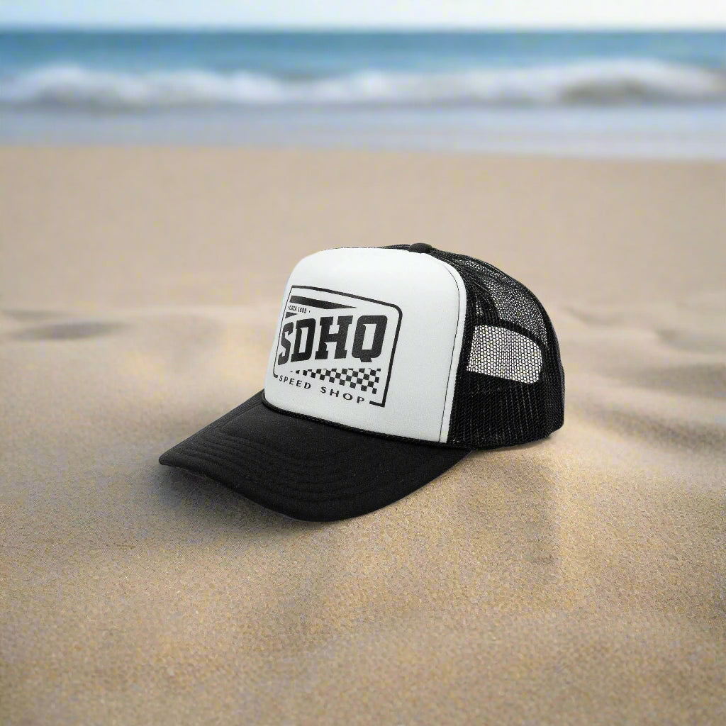 SDHQ Speed Shop Trucker Hat display on beach