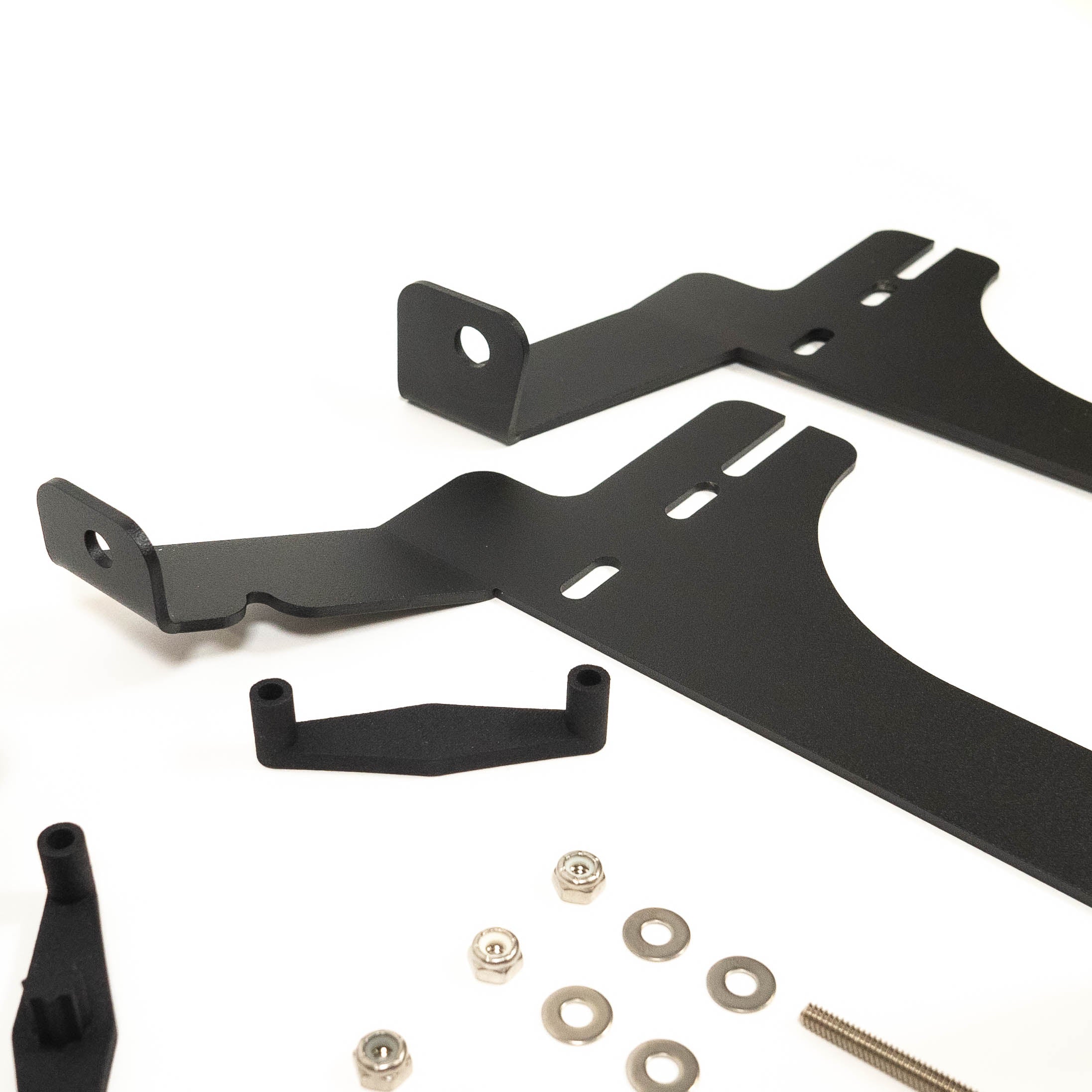 '24 Tacoma SR/SR5 Behind the Grille Light Mounting Kit close-up display of included parts and hardware 