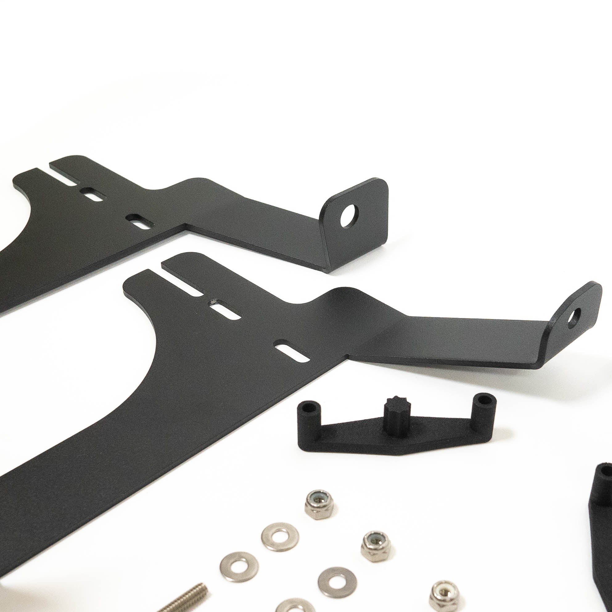 '24 Tacoma SR/SR5 Behind the Grille Light Mounting Kit close-up display of included parts and hardware 