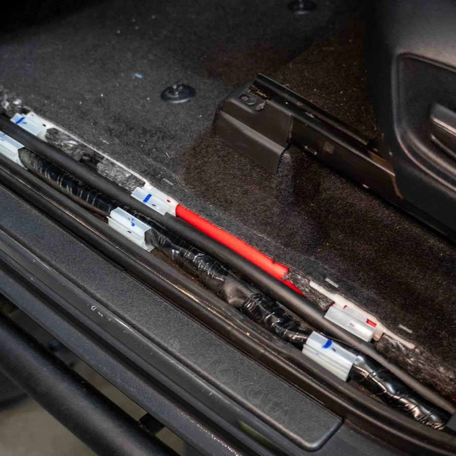 Tacoma SDHQ Built Power Solution Kit display of cables being run through interior panels