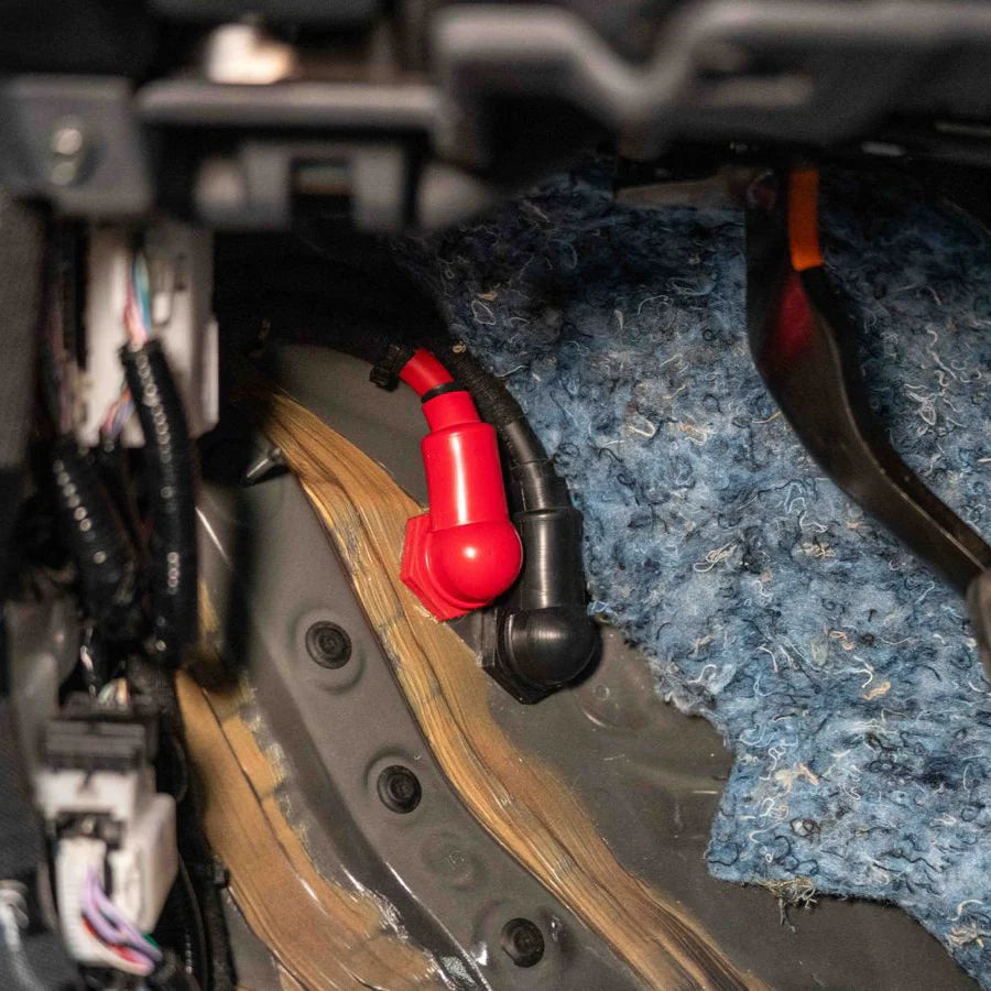 Tacoma SDHQ Built Power Solution Kit display of copper core bushings going through firewall