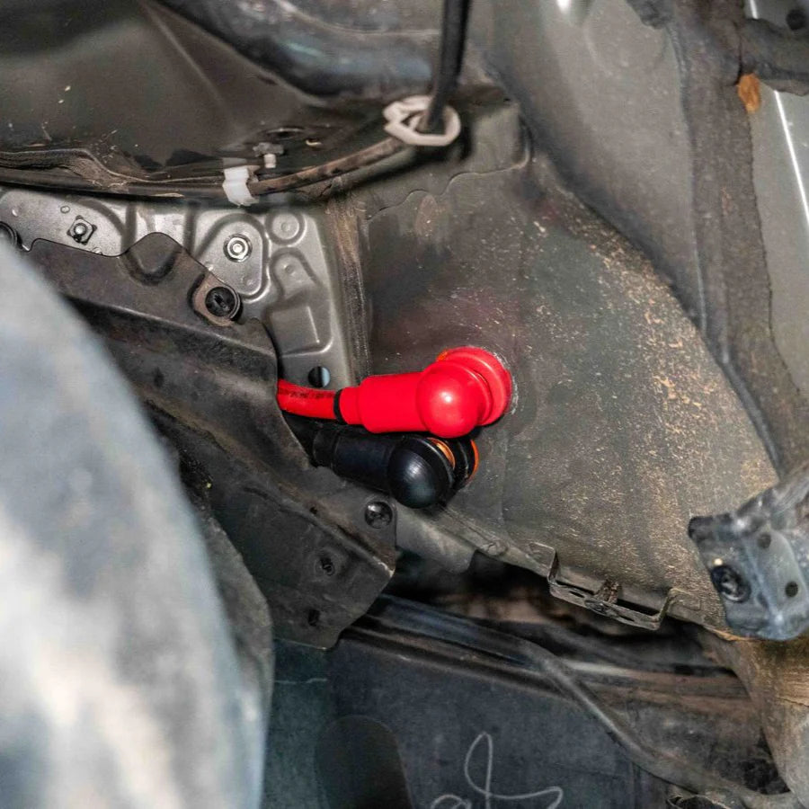 Tacoma SDHQ Built Power Solution Kit display of copper core bushings going through firewall, view from engine bay side of the connections
